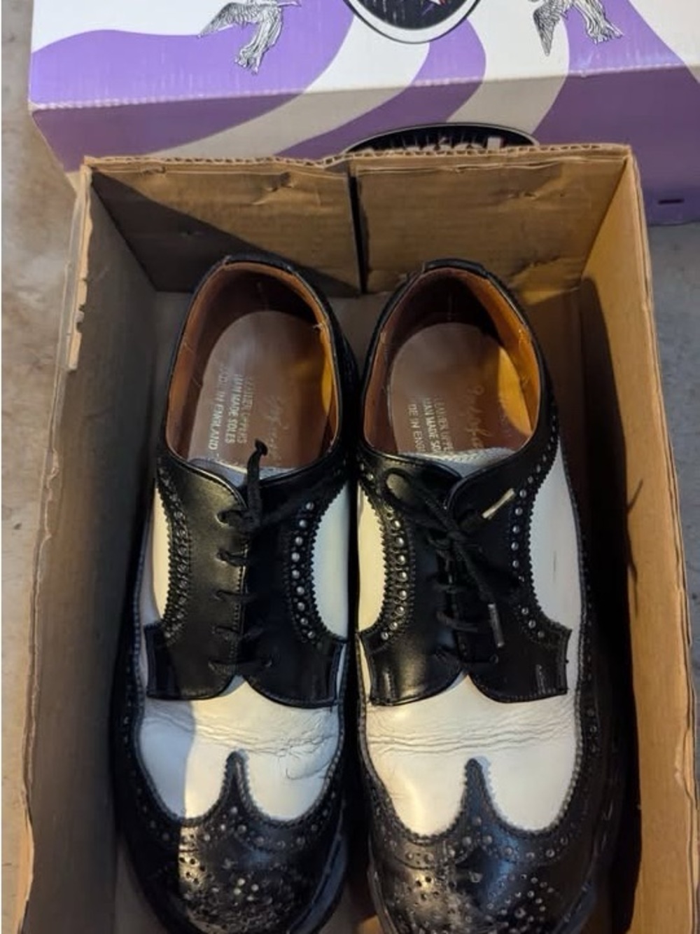 Black and White Women's Two-Tone Wingtip Flats